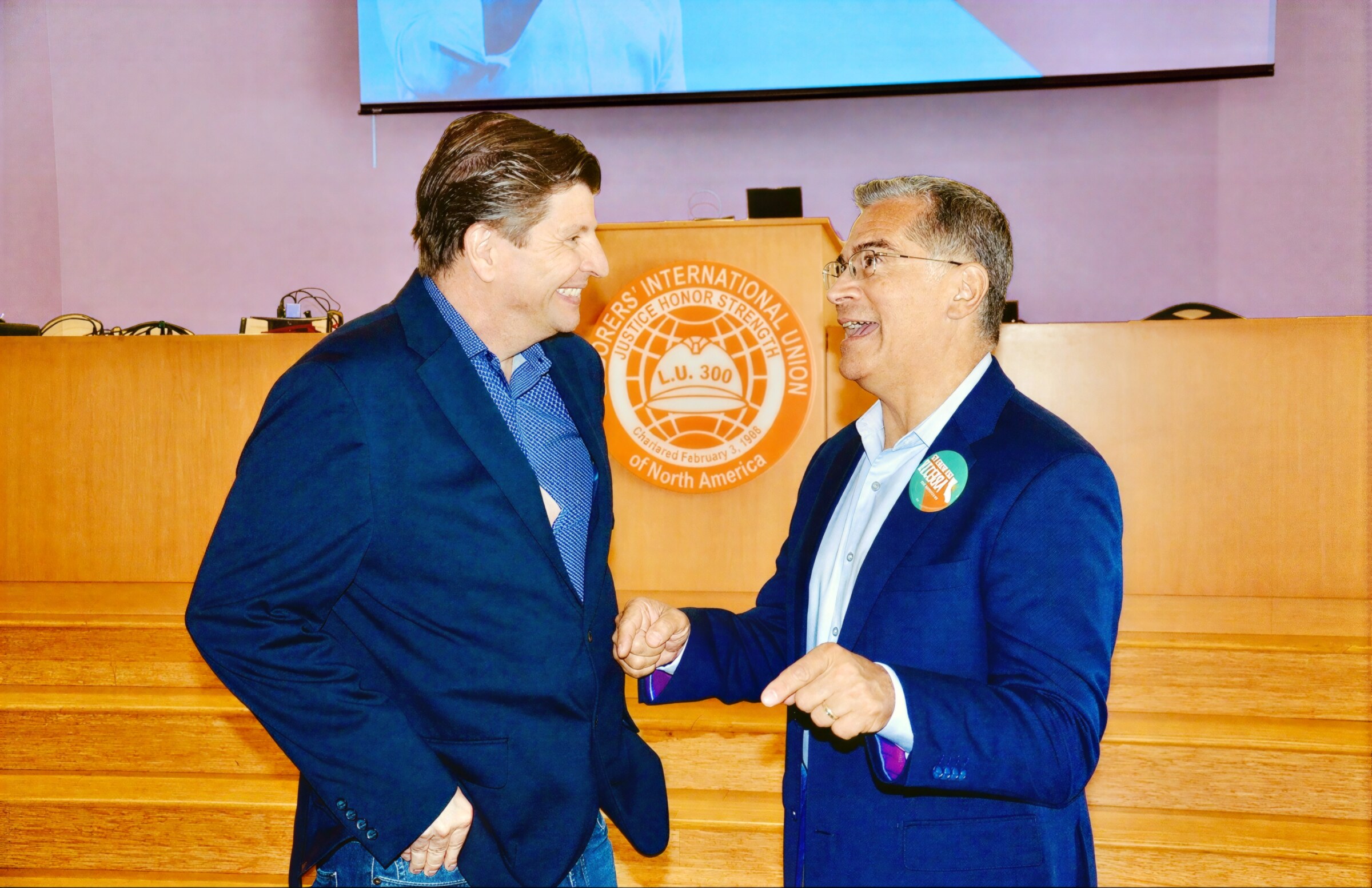 SEIU 721 President David Green shaking hands with Xavier Becerra at the LA County Federation of Labor breakfast, Laborers Local 300