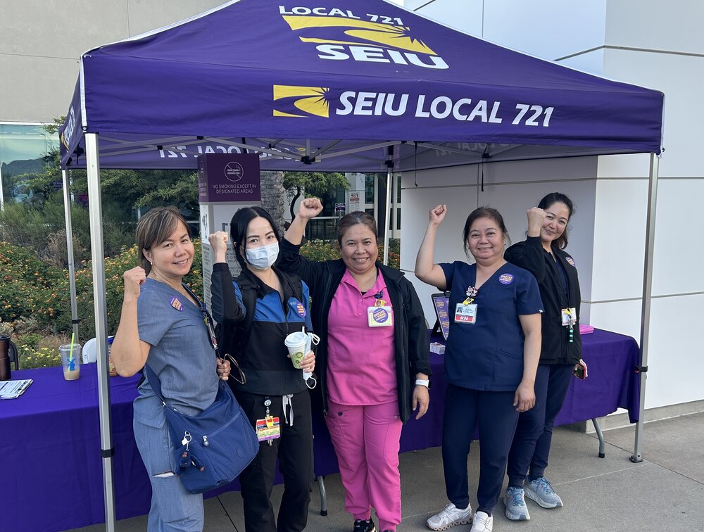 Riverside County SEIU 721 members in a clinic hallway wearing union stickers