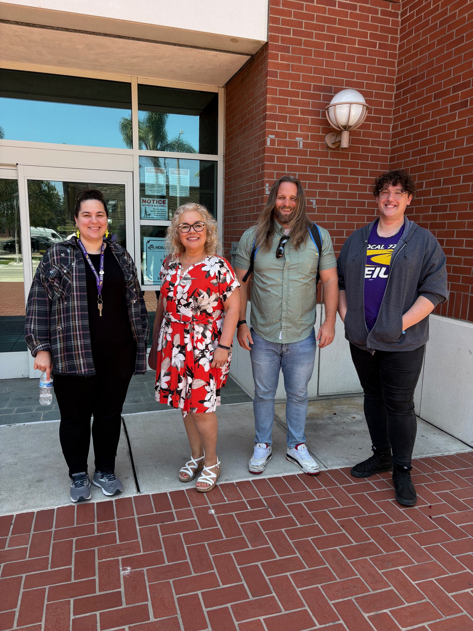 Oxnard Chapter Board members standing outside a City Hall entrance: Aaren Lindberg, Sandy Diaz, Ren Studinarz, and Alex Anand