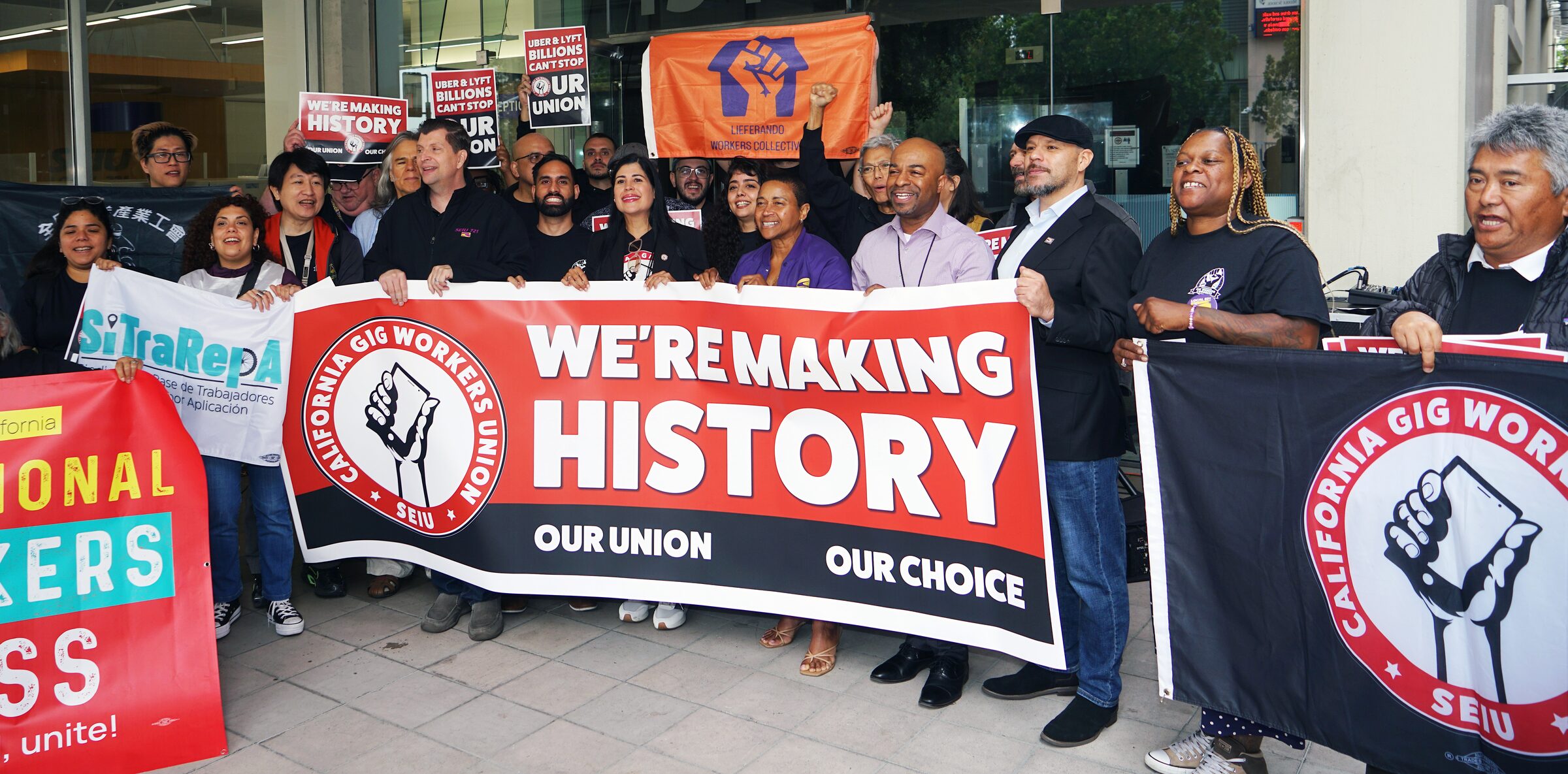 Drivers holding We're Making History banner