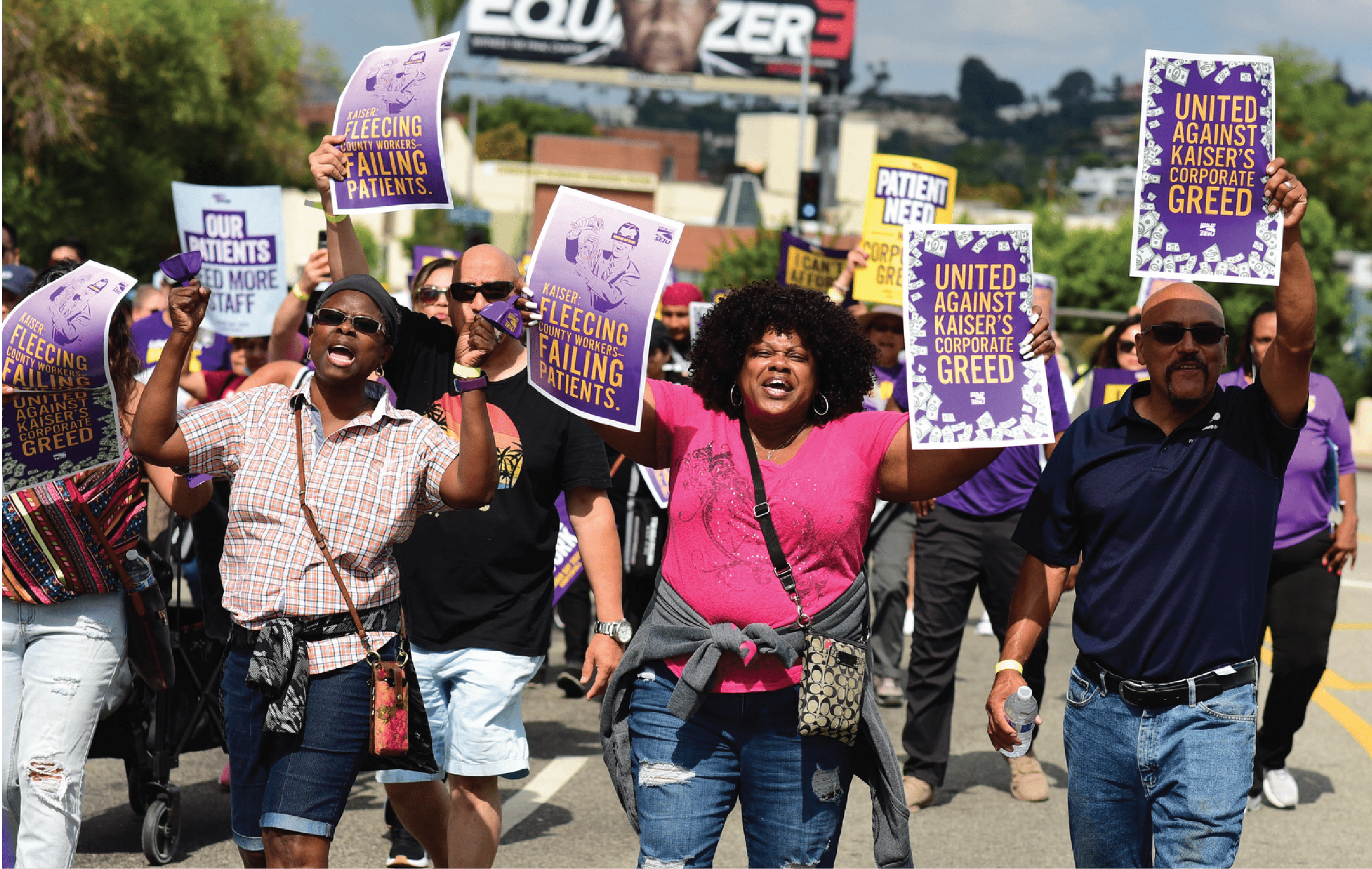 SEIU 721 members holding signs during a march on Hollywood Blvd in Los Feliz