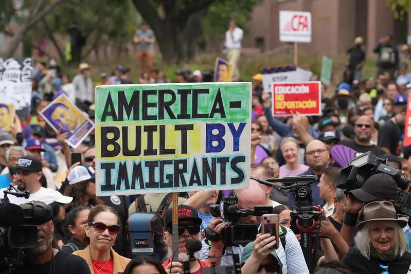 Sign at union rally: "America - Built By Immigrants"