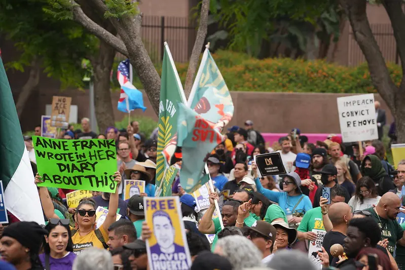 Sign at union rally: "Anne Frank Wrote in Her Diary About This"