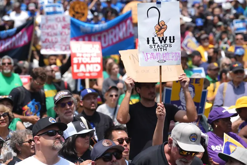 Sign at union rally: "ILWU Stands with David Huerta"