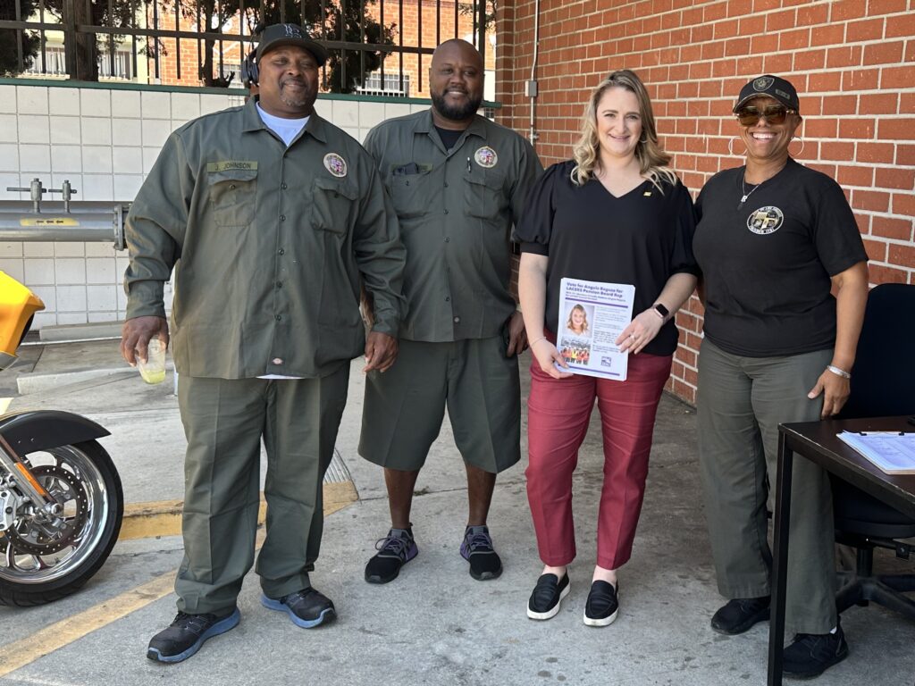 Angela Ragusa poses for a picture with City of Los Angeles employees at the Department of Recreation and Parks.