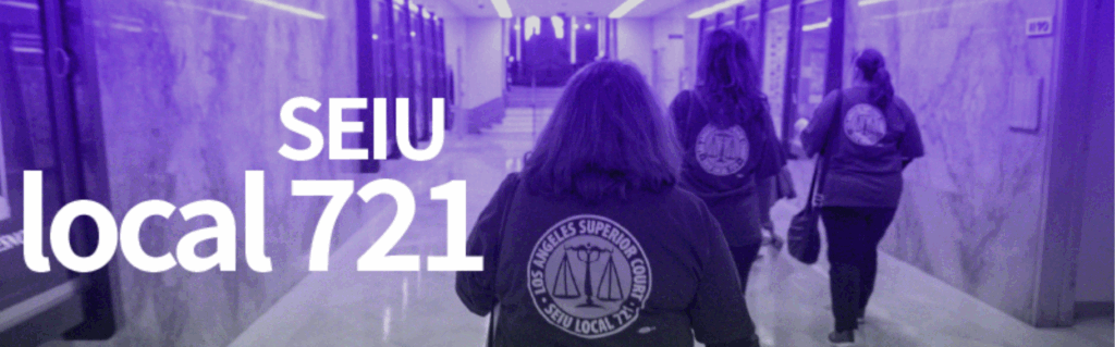 Three LA Superior Court workers in SEIU Local 721 T-shirts walk down the hallway of the Court.
