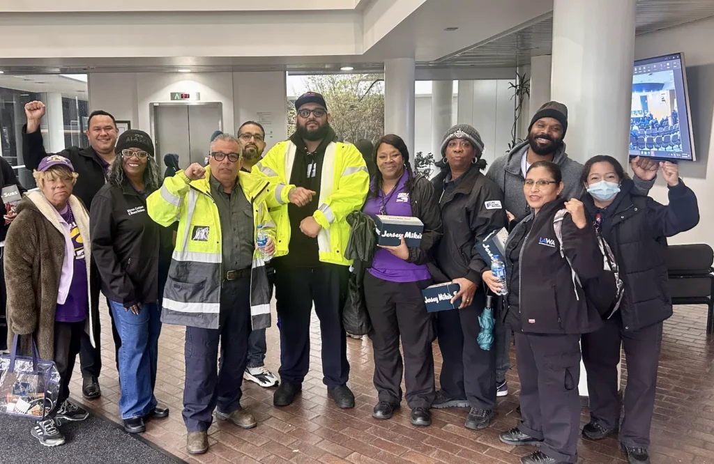 IMG_2263 SEIU 721 LAWA members in a group photo with their fists up.